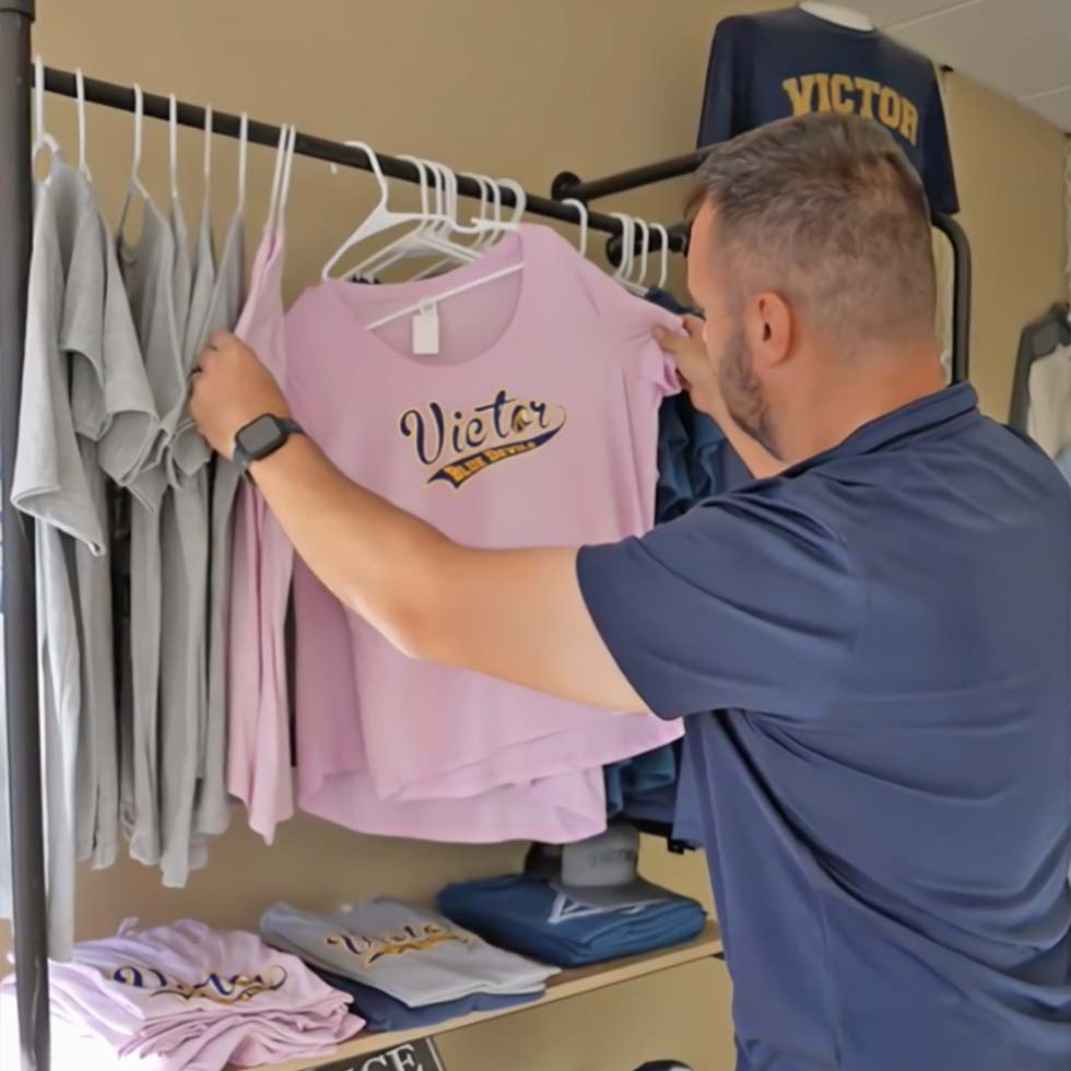 Man looking at clothes from rack